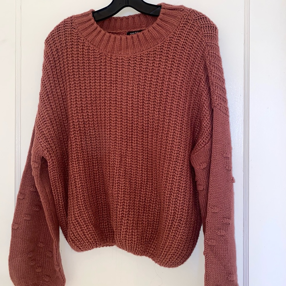 Pink knitted sweater